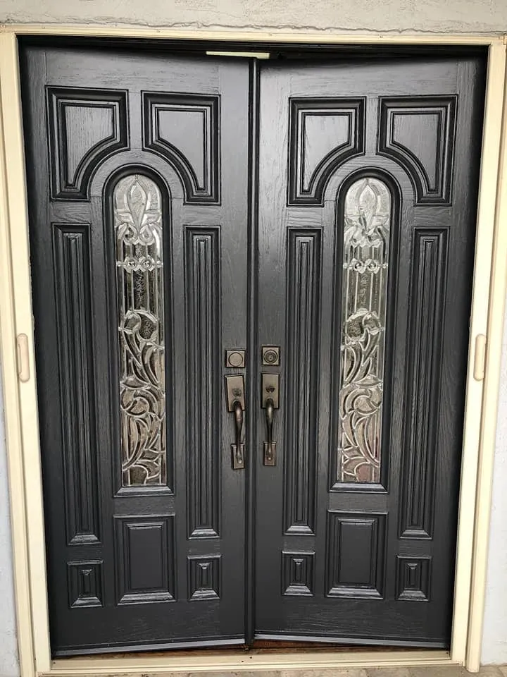 Entry doors refinished in a rich black finish